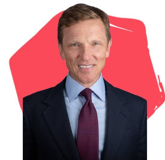 Mark Williamson, Board Director, in front of a red hexagon.